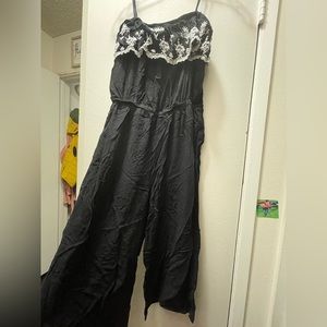 Black NOT full length jumpsuit. Strap sleeves. Embroidery.